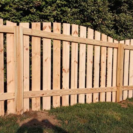 scalloped wood picket fence